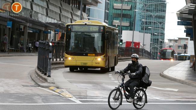 A delivery person crosses the street in the usually bustling shopping district of Parramatta. Picture: Getty Images