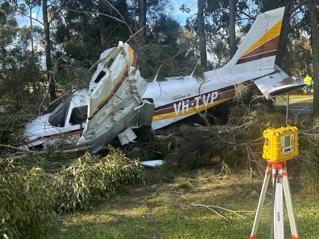 Fire and Rescue NSW (FRNSW) crews have rushed to a park in Sydney's south-west where a light plane has made a crash landing., , The single-engine aircraft, with two people on board, was on a training flight when it made a forced landing at Terone sports park in Bossley Park, around 2.30 this afternoon., , It appears the plane suffered engine failure in flight., , The young pilot shut down a series of onboard systems and made the emergency landing., , The plane has come to rest amongst trees, near sporting courts, in the corner of the park., , The pilot and his passenger suffered minor injuries but have refused treatment by ambulance paramedics., , The sports park was occupied by students from an adjacent school at the time of the crash but none have been injured., , Six fire crews, including HAZMAT and Rescue specialists, from Smithfield, Cabramatta, Bonnyrigg Heights, Yennora and Chester Hill responded to the scene, along with senior FRNSW Commanders., , Upon arrival, Police closed Restwell Road in both directions., , Firefighters have established a 100-metre fire protection zone and are monitoring the site for any atmospheric change or fuel leaks., , The aircraft was reportedly carrying up to 340 litres of fuel., , The cause of the incident is under investigation. Picture: FRNSW