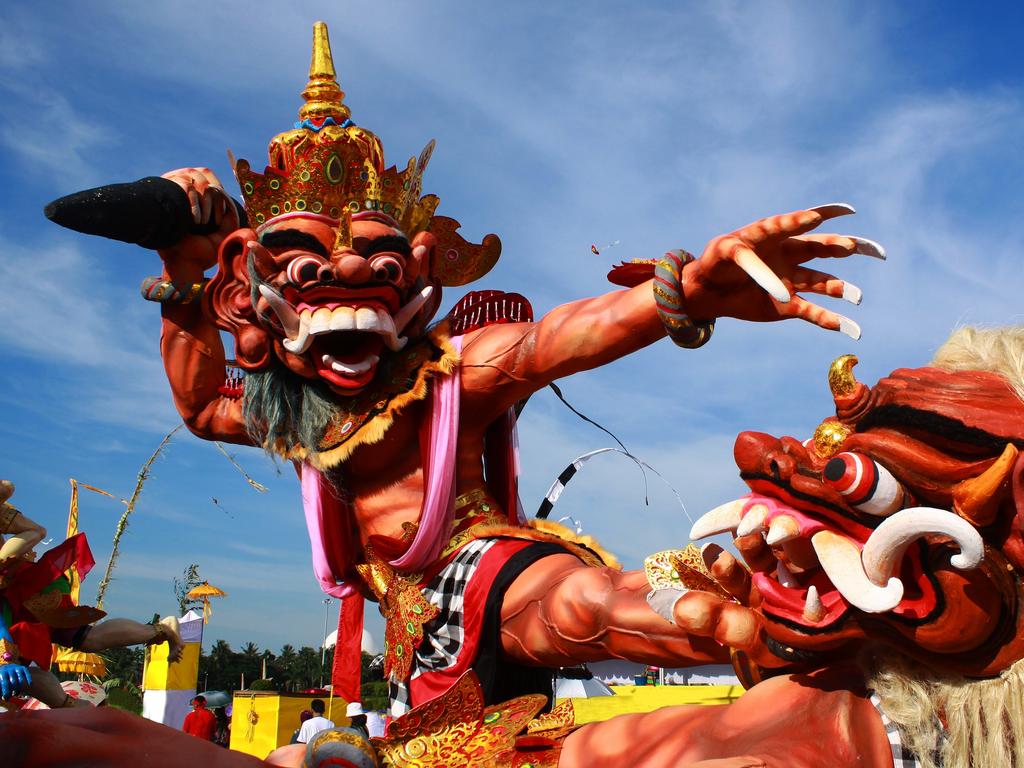 A papier-mache effigy called an ogoh-ogoh in a Balinese parade before Nyepi day.