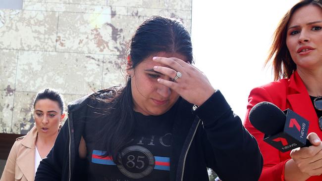 Camila Zeidan tries to shield her face as she leaves court on Monday. Picture: Toby Zerna