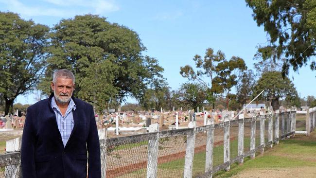 FUNDING RECEIVED: Councillor Geoff McMullen in front of the current Roma Cemetery fencing. The new PVC fencing will be installed during July and August. Picture: contributed