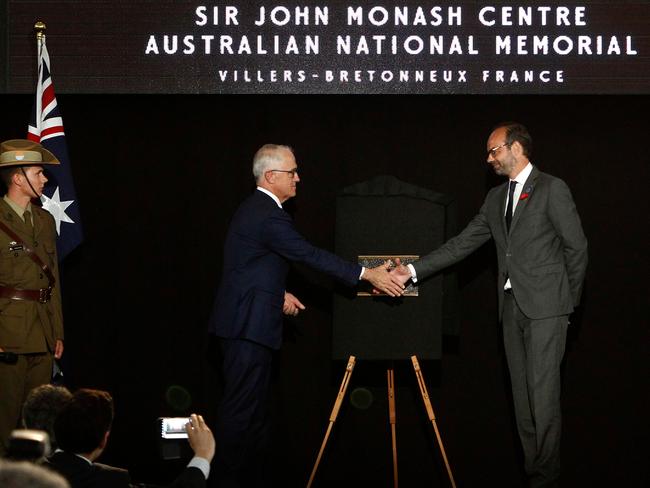 French Prime Minister Edouard Philippe, right, and Australian Prime Minister Malcolm Turnbull unveil a plaque at the Sir John Centre Australian National Memorial. Picture: AP