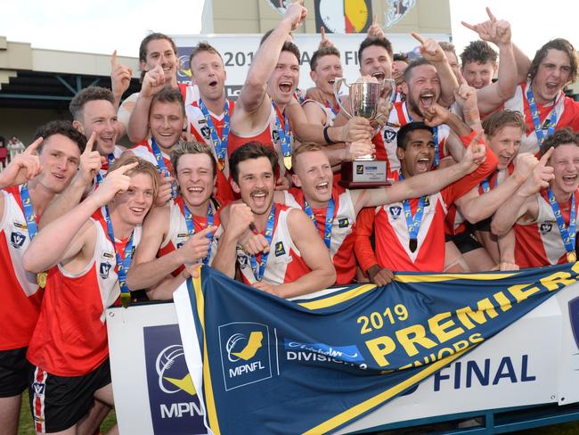 The jubilant Red Hill players bunch for a premiership pic. Picture:Chris Eastman