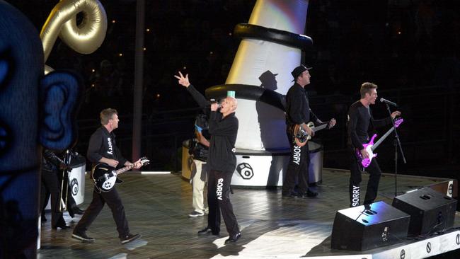 Midnight Oil performing at the closing ceremony of the Sydney Olympic Games on October 1, 2000. Picture: Nathan Edwards