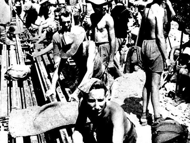 Australian and allied prisoners of war labouring at Hellfire Pass. This photo was taken by the Japanese for propaganda purposes and did not reflect the brutality.