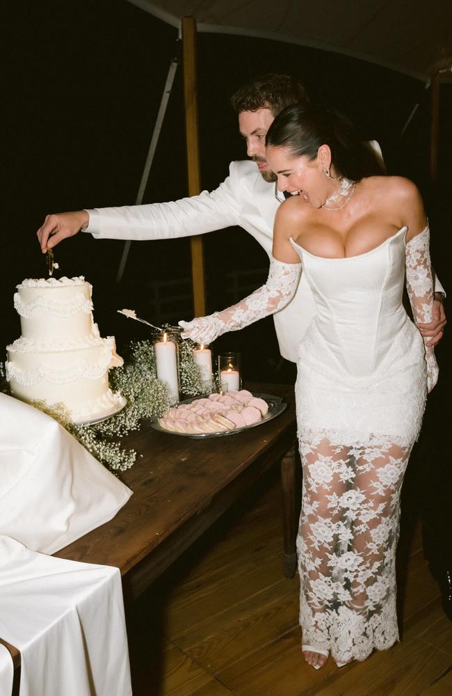 The newlyweds cut their wedding cake. Picture: Sarah Partain