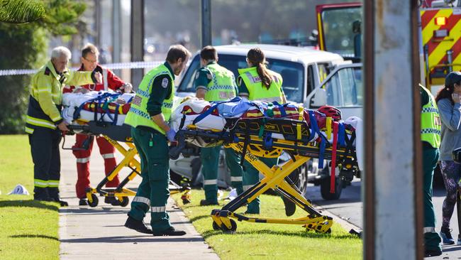 The father and son cyclists are taken to hospital by paramedics. Picture: AAP / Brenton Edwards