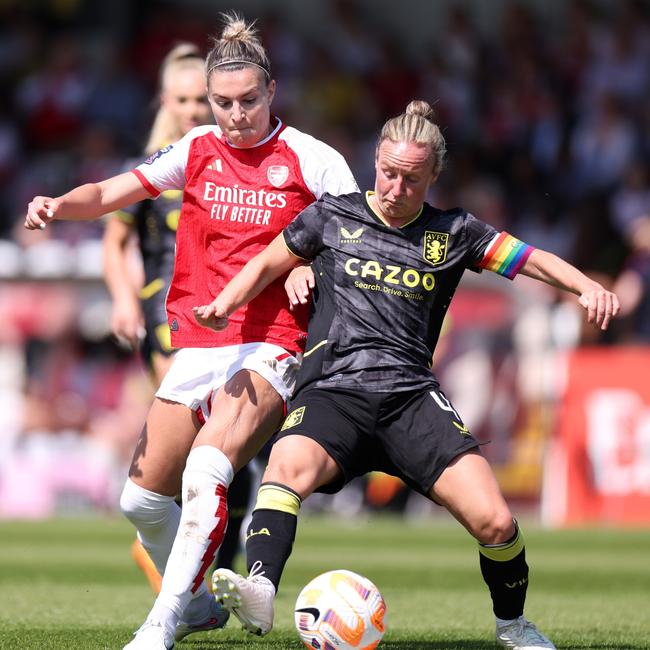 Steph Catley battles for possession with Arsenal.