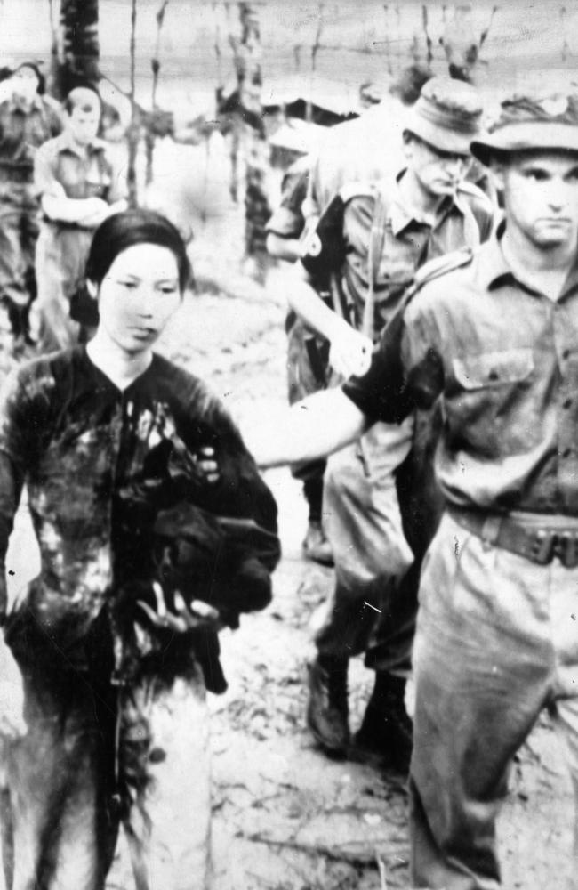 ‘As good as the men at fighting’ ... an Australian soldier leads a female Viet Cong prisoner at the Task Force Headquarters at Nui Dat, March 1968.