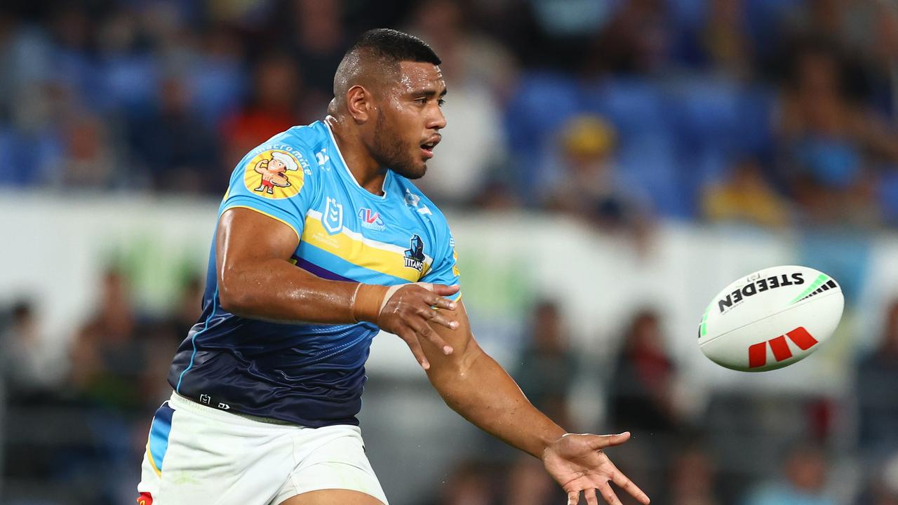 GOLD COAST, AUSTRALIA - JUNE 03: Moeaki Fotuaika of the Titans passes during the round 14 NRL match between Gold Coast Titans and South Sydney Rabbitohs at Cbus Super Stadium on June 03, 2023 in Gold Coast, Australia. (Photo by Chris Hyde/Getty Images)