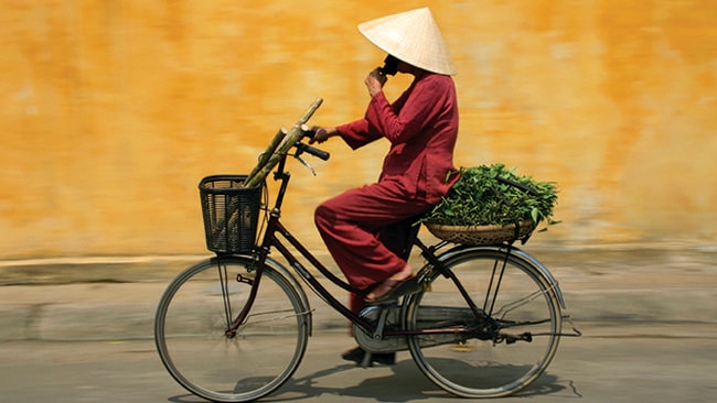 Join the locals or cycle on your own. Whatever you do, you'll love cycling through Vietnam. Picture: Intrepid Travel