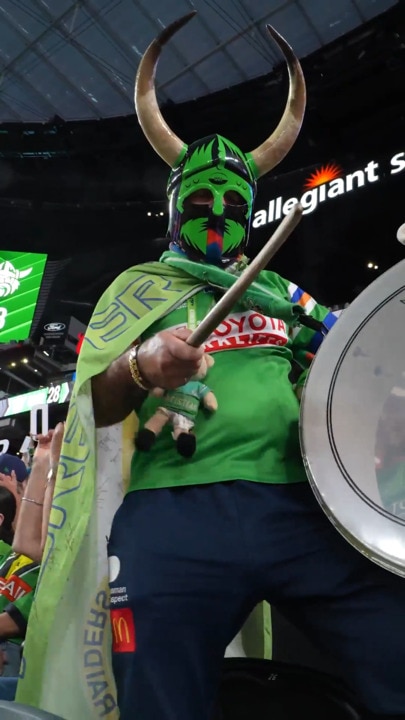 Raiders fans celebrate Canberra's big win with the viking clap