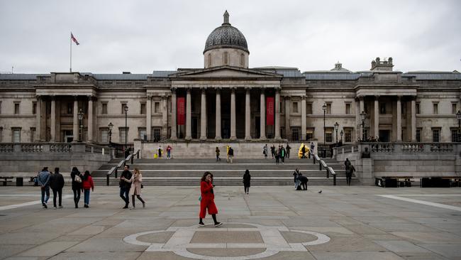 Pedestrians walk through Trafalgar Square on the weekend. Picture: Getty Images