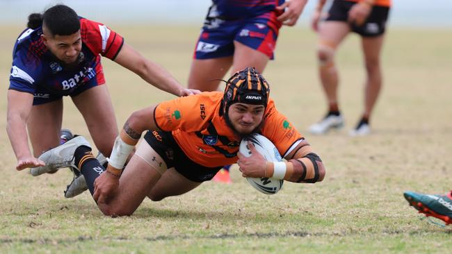 Challis Tupuola scores for The Oaks Tigers against Campbelltown Collegians. Picture: Steve Montgomery