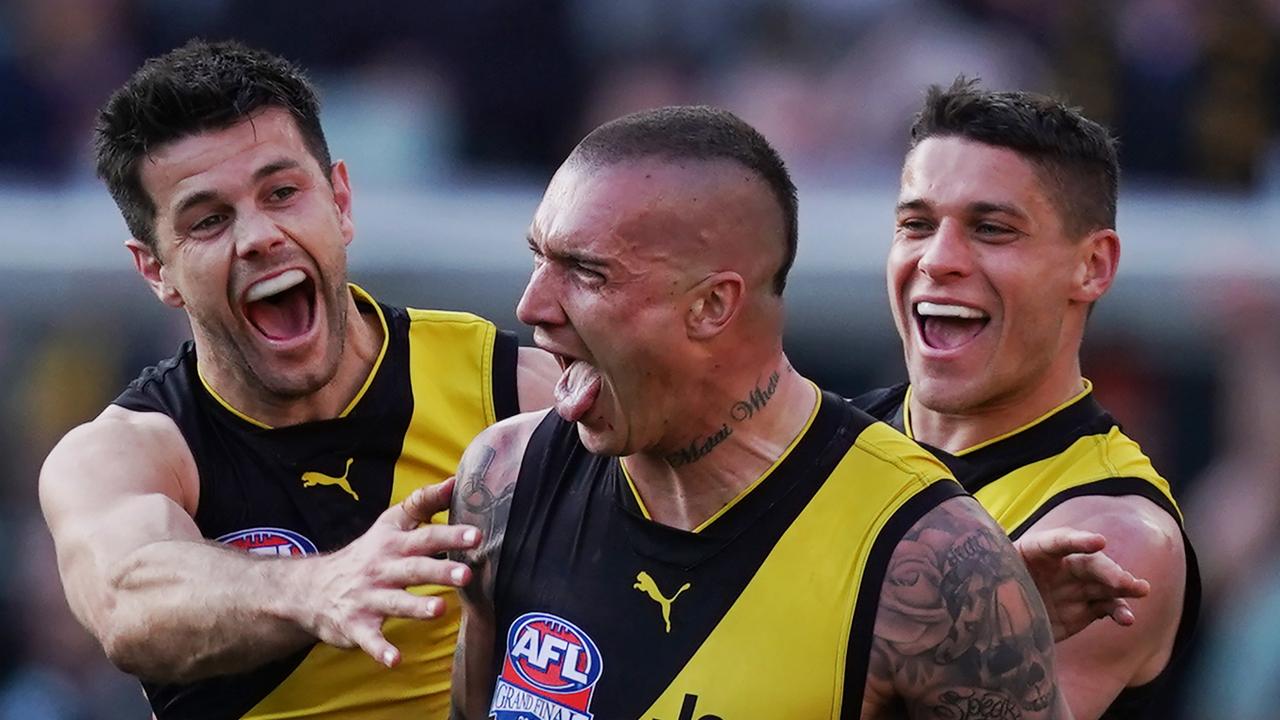 Dustin Martin celebrates a goal in last year’s Grand Final with Trent Cotchin and Dion Prestia.