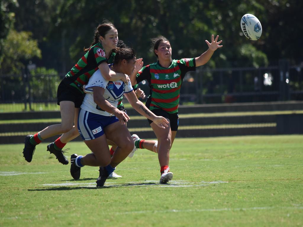 Amelia Pasikala is tackled by Georgie Coote. Picture: Sean Teuma/NewsLocal