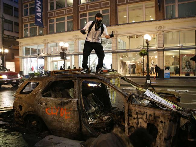 Protesters riot in the streets in Seattle, Washington. Picture: Karen Ducey