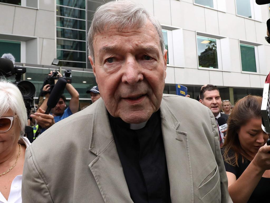 Cardinal George Pell (C) leaves the County Court of Victoria court after prosecutors decided not to proceed with a second trial on alleged historical child sexual offences in Melbourne on February 26, 2019. - Australian Cardinal George Pell, who helped elect popes and ran the Vatican's finances, has been found guilty of sexually assaulting two choirboys, becoming the most senior Catholic cleric ever convicted of child sex crimes. (Photo by Asanka Brendon Ratnayake / AFP)