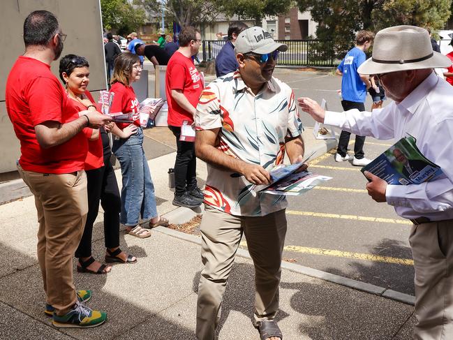 Liberal candidate Steve Murphy approaches a voter. Picture: Ian Currie