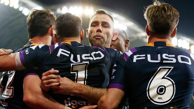 Cameron Smith celebrates with Storm teammates during his side’s win over the Rabbitohs. Picture: Getty Images