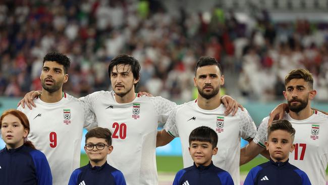 (From L) Iran's forward #09 Mehdi Taremi, Iran's forward #20 Sardar Azmoun, Iran's defender #08 Morteza Pouraliganji and Iran's midfielder #17 Ali Gholizadeh sing the national anthem prior to the Qatar 2022 World Cup Group B football match between Iran and USA. Picture: Fadel Senna/AFP