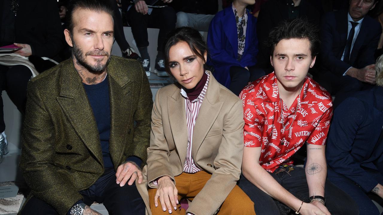 Brooklyn Beckham with his very famous parents. Picture: Pascal Le Segretain/Getty Images