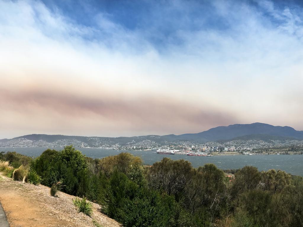 Smoke from an out-of-control bushfire in the Wilderness World Heritage Area in the South-West covered Hobart on January 4. Picture: AAP/Ethan James