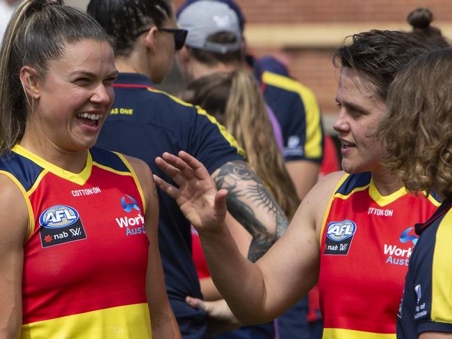 Courtney Gum, right, shares a laugh with midfielder Anne Hatchard after the Crows’ trial game against GWS on Saturday. Picture: AAP/Emma Brasier