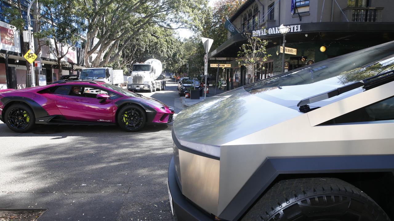 Just another day in Double Bay! A driver admiring a Tesla Cyber Truck from his sports car. Picture: John Appleyard