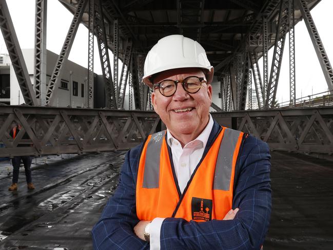 Nigel Chamier AM inspecting the Story Bridge from the suspended scaffolding. Picture: Liam Kidston