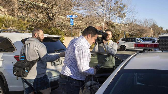 Will Fowles is taken by police from Abode Apartments. Picture: Sean Davey.