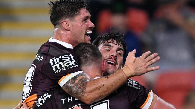 BRISBANE, AUSTRALIA - MARCH 10: Kurt Capewell of the Broncos  celebrates with teammates after scoring a try during the round two NRL match between the Brisbane Broncos and the North Queensland Cowboys at Suncorp Stadium on March 10, 2023 in Brisbane, Australia. (Photo by Bradley Kanaris/Getty Images)