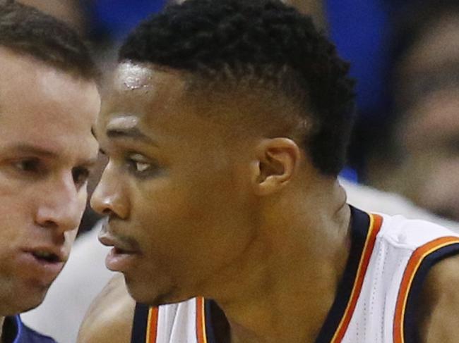 Oklahoma City Thunder guard Russell Westbrook (0) drives against Dallas Mavericks guard J.J. Barea, left, during the second quarter of an NBA basketball game in Oklahoma City, Wednesday, Jan. 13, 2016. (AP Photo/Sue Ogrocki)