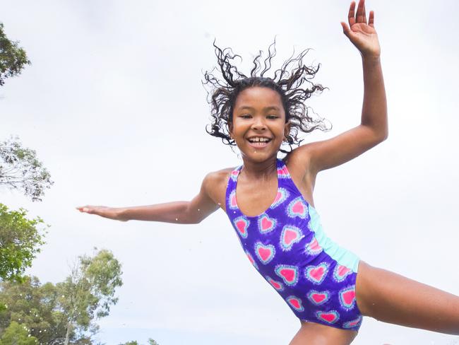 8 year old Kiri Todhunter from Ninderry kicked off her school holidays with a splash at Noosa River, followed by fish and chips on the beach. Photo Lachie Millard