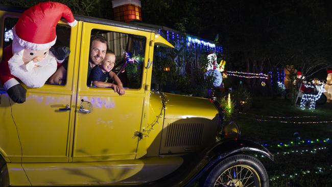 Kyle Johnston and his three-year-old son Oliver visit the Christmas lights display of Des and Merryl Pearce, Tuesday, December 14, 2021. Picture: Kevin Farmer