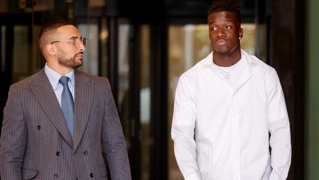 Adam Ghaboush (right) pictured leaving Downing Centre Local Court on Thursday with lawyer Ahmed Dib. Picture: NCA NewsWire / Nikki Short