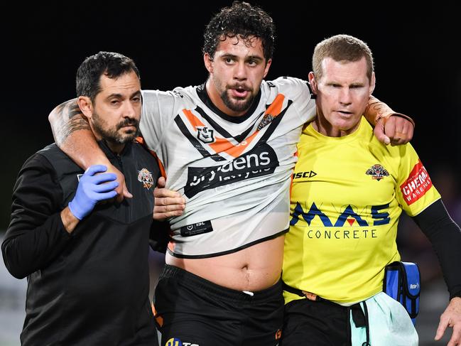 Wests Tigers won’t be bullied anymore. Josh Aloiai is helped from the field. Picture: Nathan Hopkins/NRL Photos