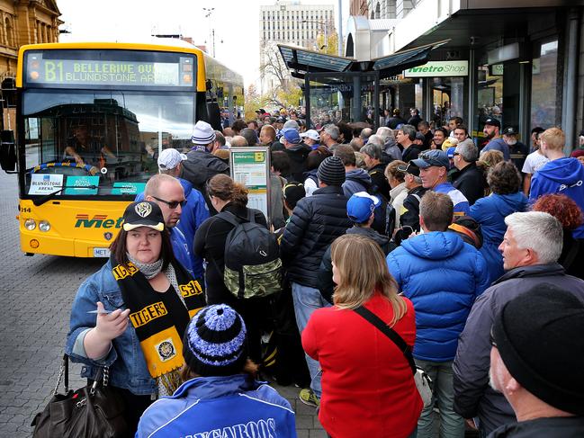 AFL North Melbourne v Richmond at Blundstone Arena. hundreds of supporters wait for buses in the bus mall