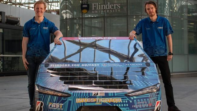 Bryn (left) and Ethan (right) from Darwin helped design a solar-powered car for this year’s Bridgestone World Solar Challenge. Picture: Supplied