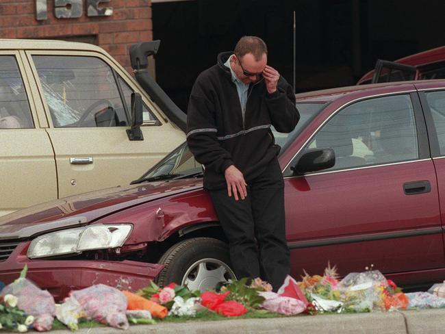 Upset people visit and leave flowers for policemen Rodney Miller and Gary Silk in Moorabbin.