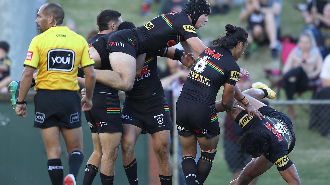 Brian To’o (right) mistimed his jump and fell off the back of a Panthers’ try celebration. Picture: Matt Blyth/Getty Images