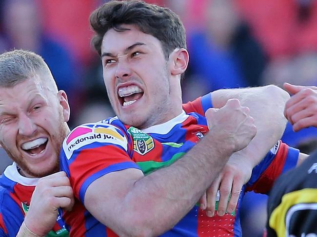 NEWCASTLE, AUSTRALIA - JULY 21:  Nick Meaney of the Knights celebrates his try with team mates during the round 19 NRL match between the Newcastle Knights and the Gold Coast Titans at McDonald Jones Stadium on July 21, 2018 in Newcastle, Australia.  (Photo by Ashley Feder/Getty Images)