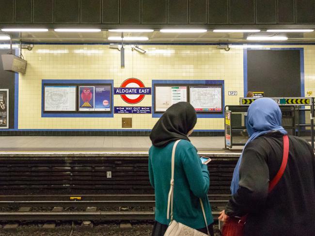 London, UK - June 21, 2017 - Two Muslim women waiting on the platform at Aldgate East tube station