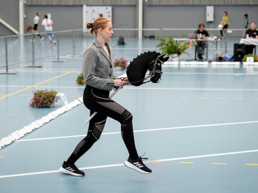 A rider takes part in a dressage event at the Finnish Hobbyhorse Championships