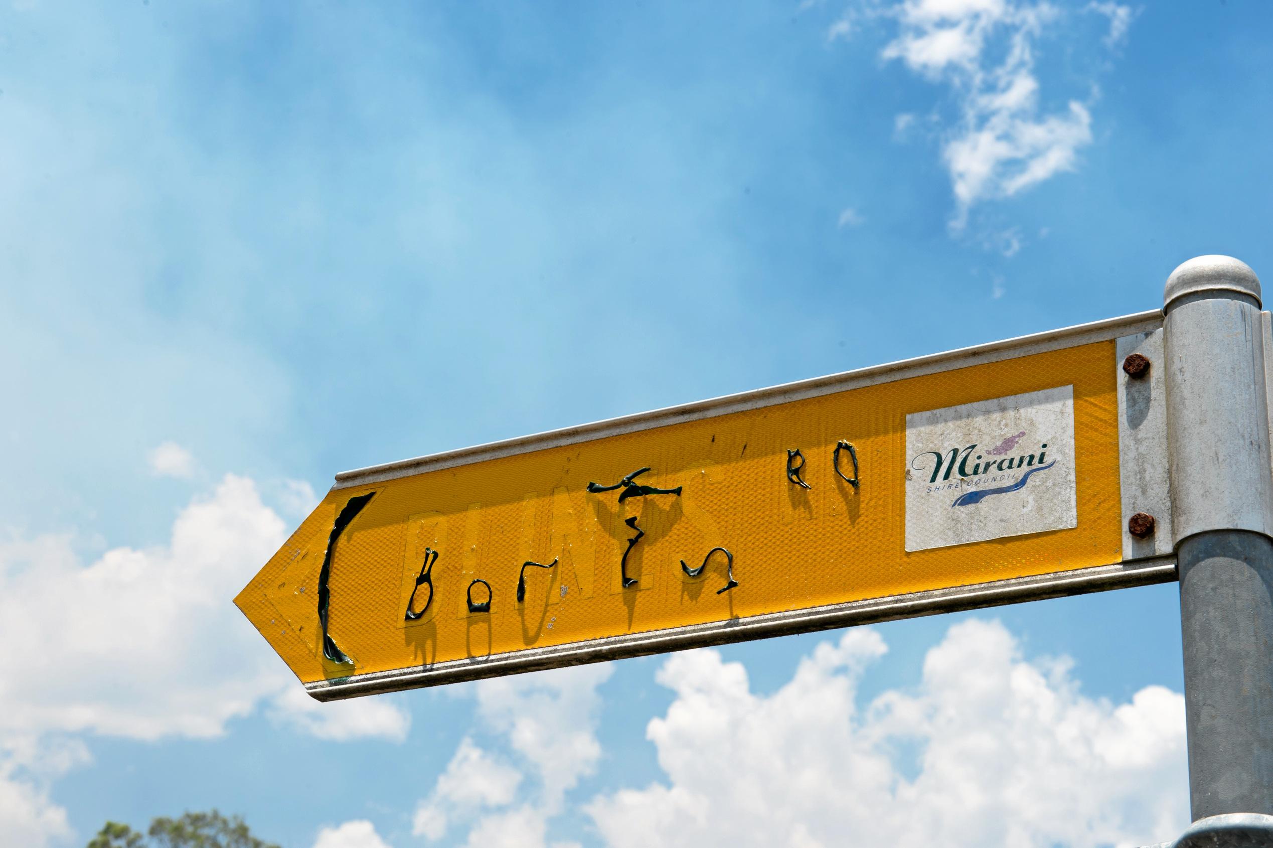 The melted sign of Blines Road where a home was destroyed by fire. Picture: Emma Murray