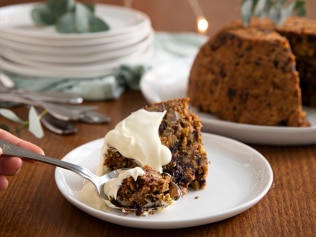 No Christmas spread is complete without the fiery entertainment and sweet smell of a Christmas pudding. Image: Supplied