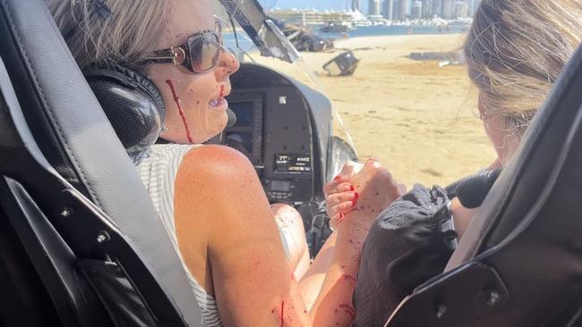 Elmarie Steenberg and Marle Swart hold hands after the helicopter crash.