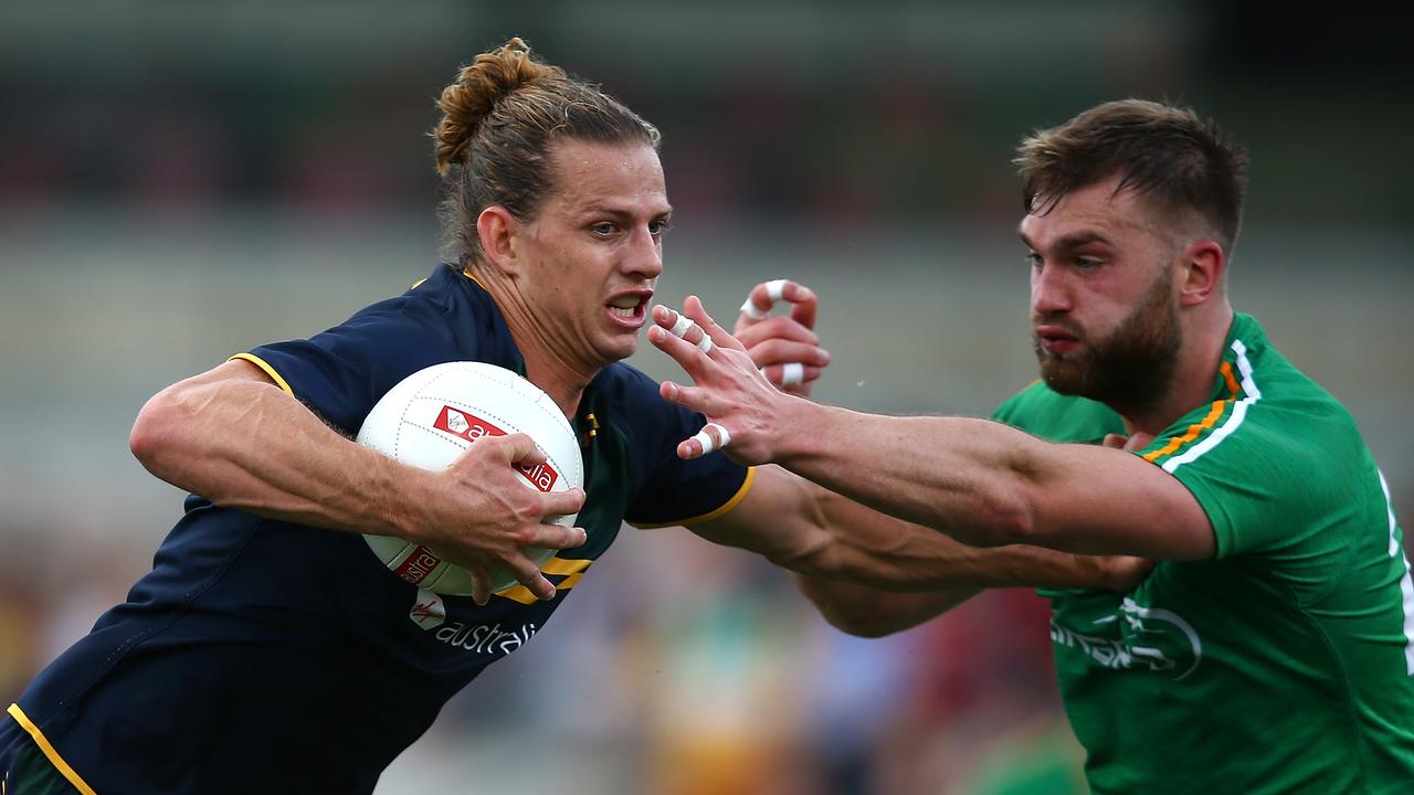 PERTH, AUSTRALIA - NOVEMBER 18: Nathan Fyfe of Australia fends off a tackle by Aidan O'Shea of Ireland during game two of the International Rules Series between Australia and Ireland at Domain Stadium on November 18, 2017 in Perth, Australia. (Photo by Paul Kane/Getty Images)