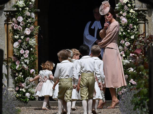 Keeping everyone in line. The Duchess of Cambridge leads the bridesmaids and pageboys into the church ahead of her sister Pippa Middleton's wedding. Picture: AFP PHOTO / POOL AND AFP PHOTO / Justin TALLIS