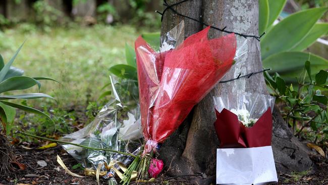 Flowers laid at the Lovell home in Whitfield Crescent, North Lakes. Picture: David Clark